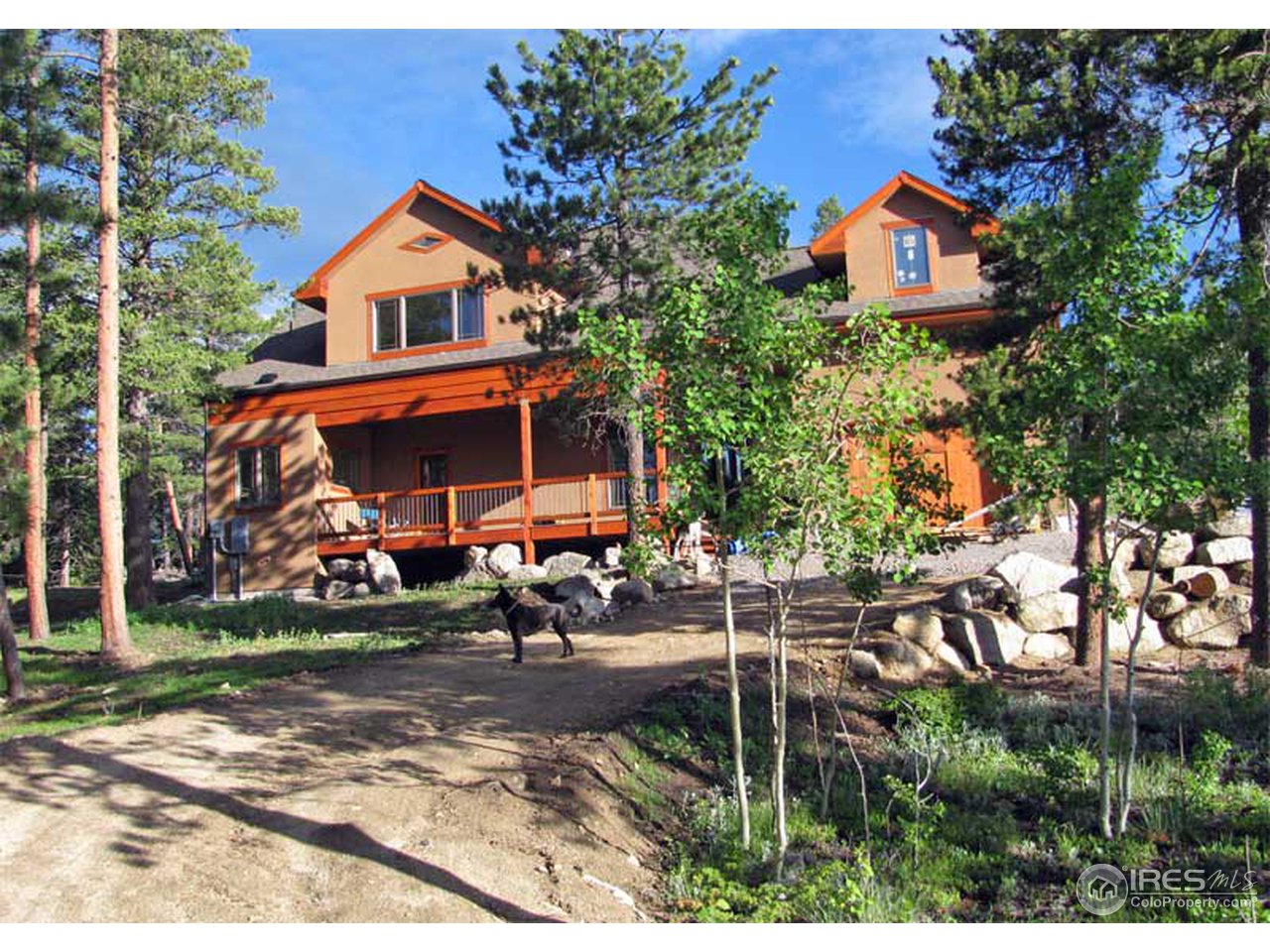 2607 Ridge Road Nederland, CO 80466 - Photo 1 of 18 an outdoor view of a house with garden
