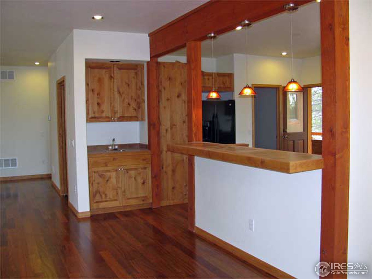 2607 Ridge Road Nederland, CO 80466 - Photo 4 of 18 a view of a hallway with wooden floor and a bathroom