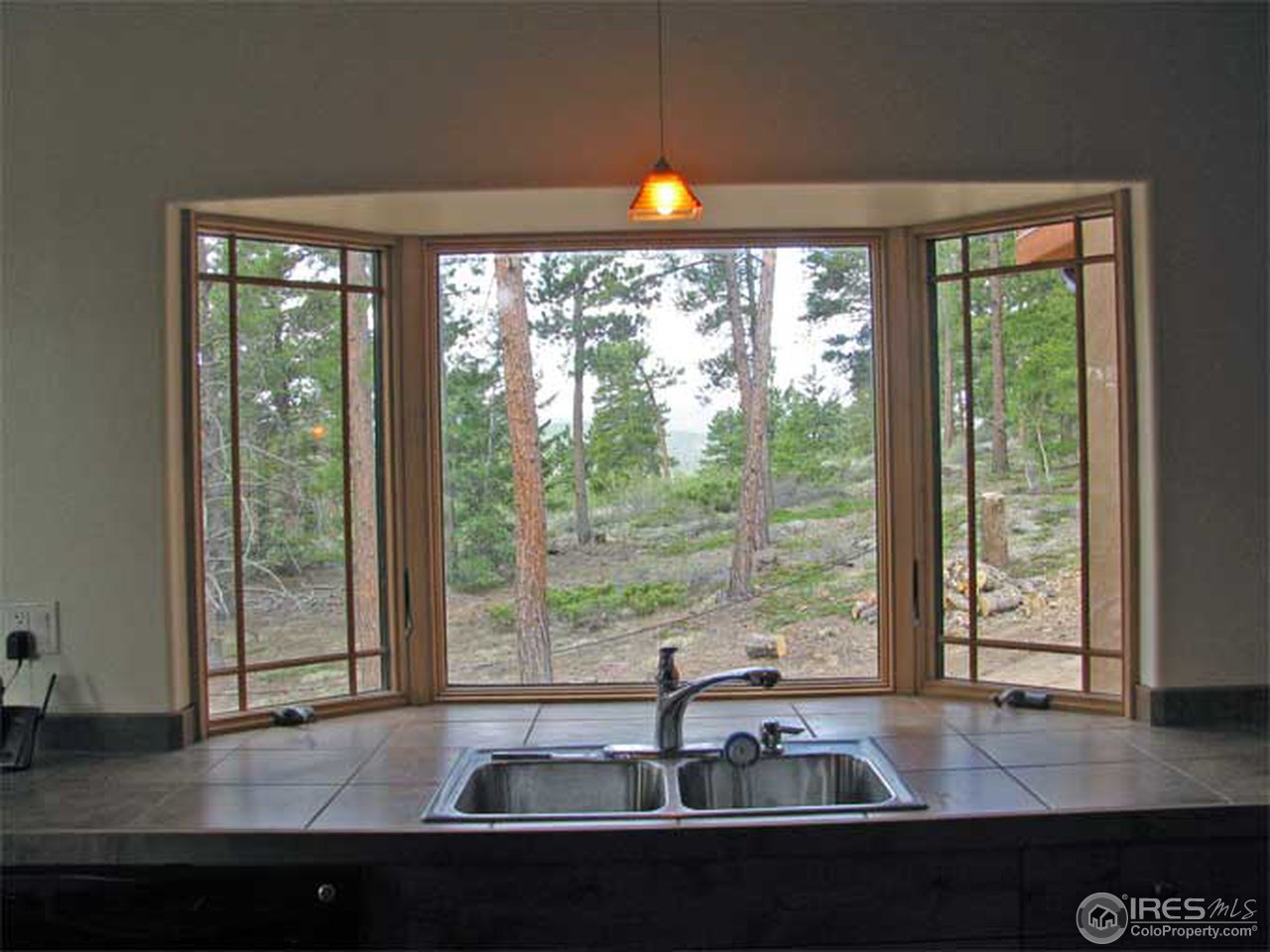 2607 Ridge Road Nederland, CO 80466 - Photo 5 of 18 a living room with large windows