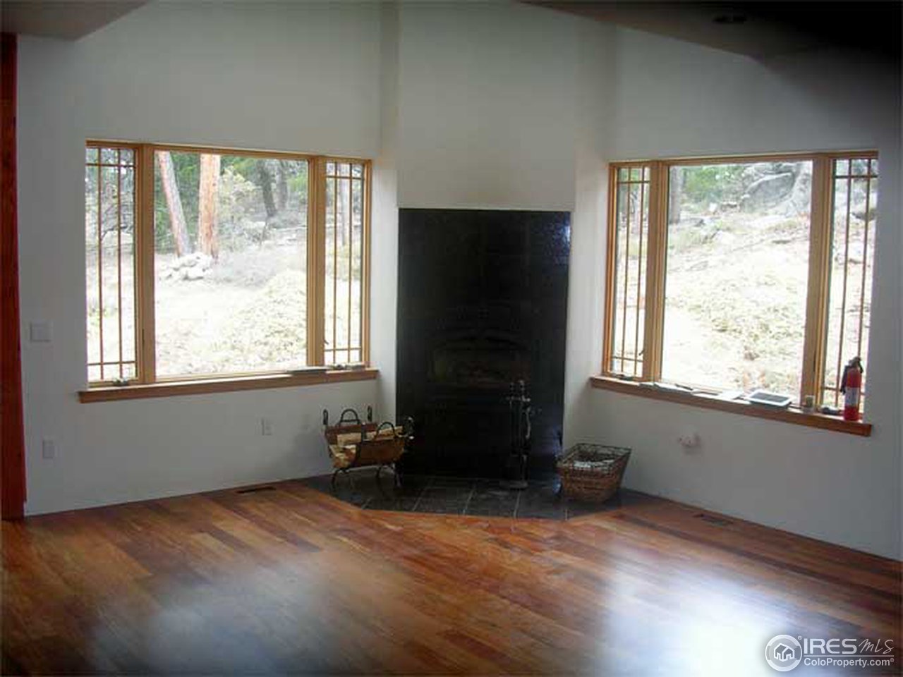 2607 Ridge Road Nederland, CO 80466 - Photo 6 of 18 a room with wooden floor and a window