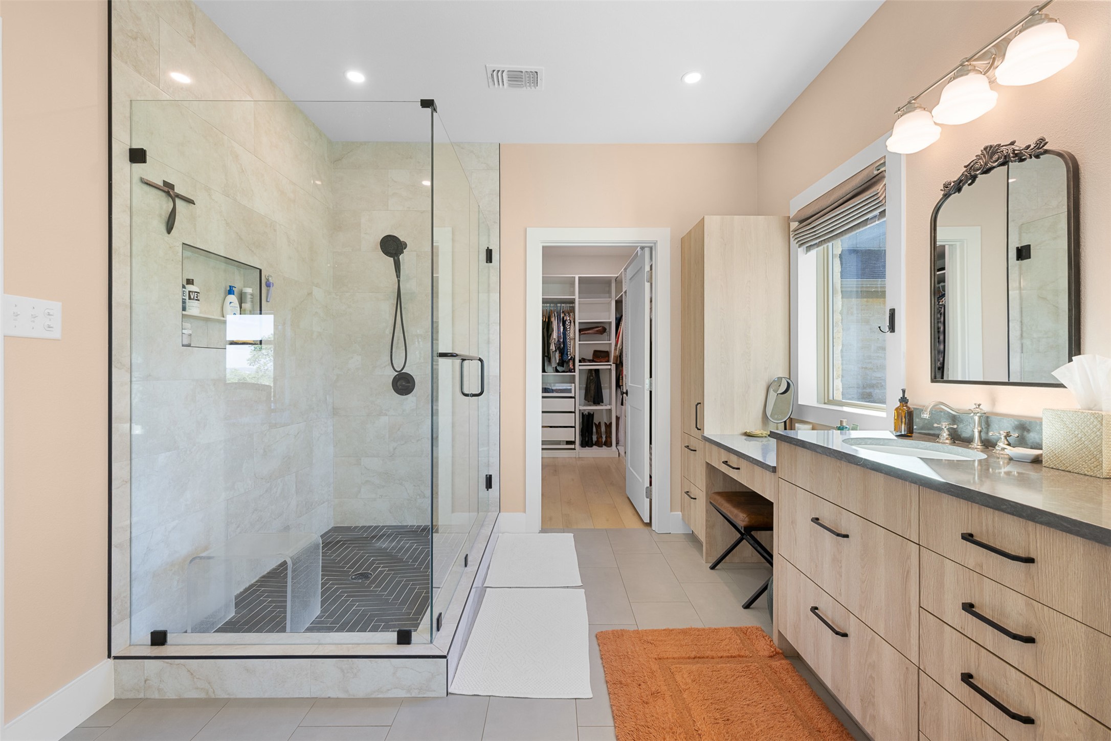 3340 Briggs Road Killeen, TX 76549 - Photo 25 of 40 a bathroom with a double vanity sink a large mirror and shower