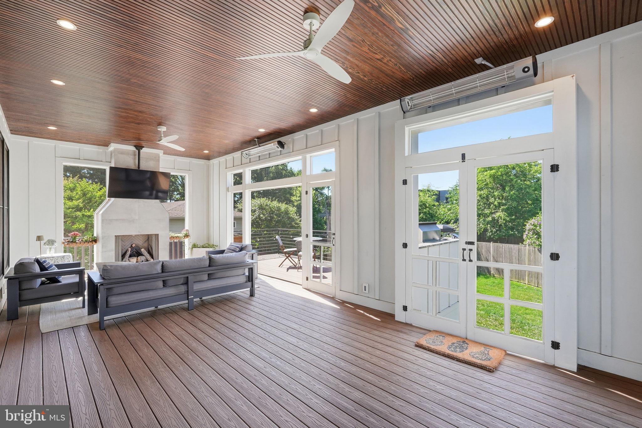 6026 Little Falls Road Arlington, VA 22207 - Photo 15 of 44 3 seasons porch with fans and gas fireplace