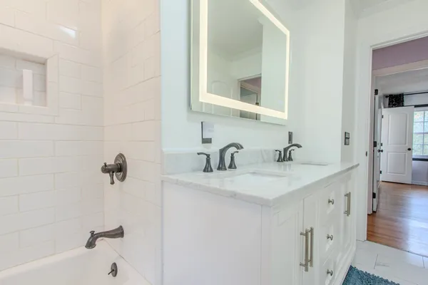 a bathroom with a sink and a mirror