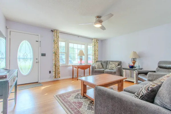 a living room with furniture and a large window