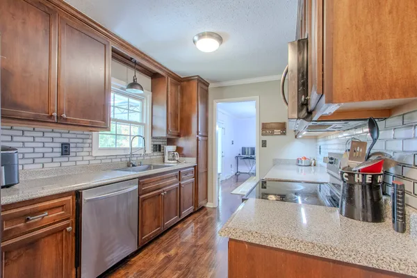 a kitchen with lots of counter top space and appliances