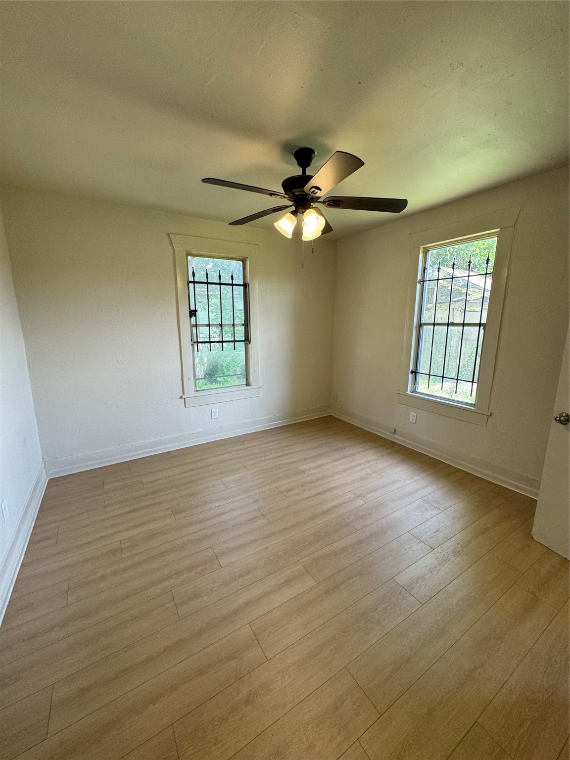 3428 Reeves Street Houston, TX 77004 - Photo 3 of 10 a view of an empty room with a window