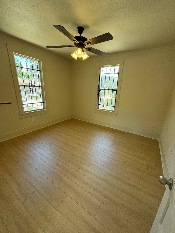 3428 Reeves Street Houston, TX 77004 - Photo 7 of 10 a view of an empty room with a window and wooden floor