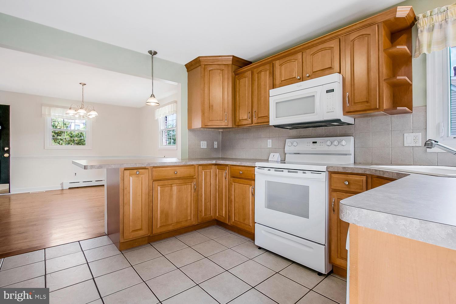 106 Devonshire Road Wilmington, DE 19803 - Photo 9 of 26 Wood cabinetry & ceramic tile floor