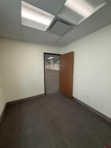 an empty room with closet area