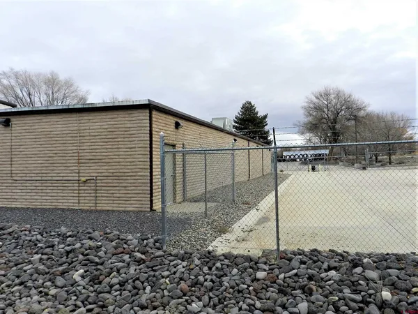a view of outdoor space with yard and mountain view