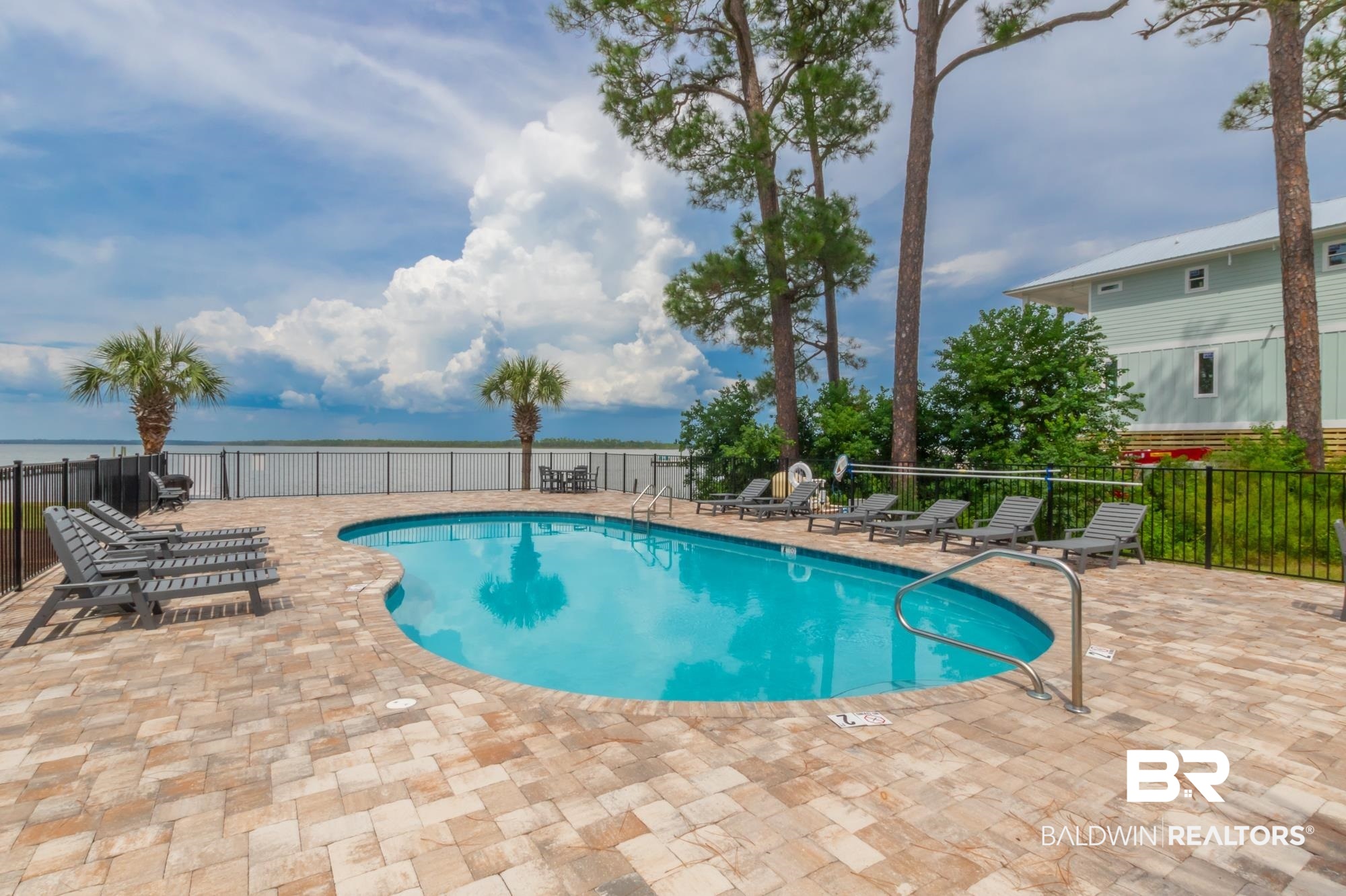 25925 -C Canal Road, Unit 203 Orange Beach, AL 36561 - Photo 33 of 57 View of swimming pool with a patio