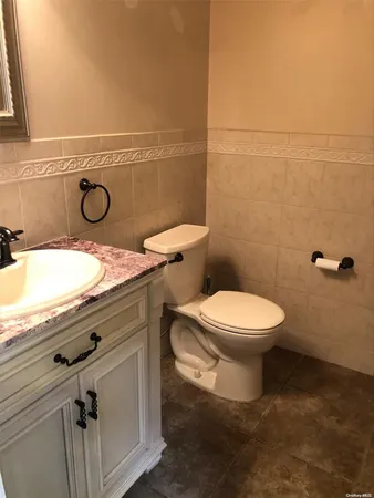 a bathroom with a toilet and a sink