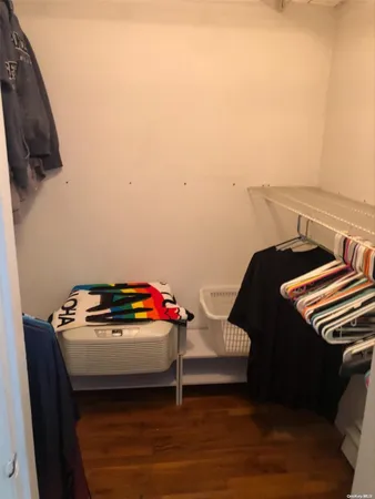 a bedroom with a bed and cabinets