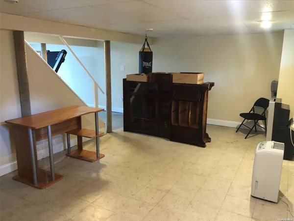 a bedroom with a bed and cabinets