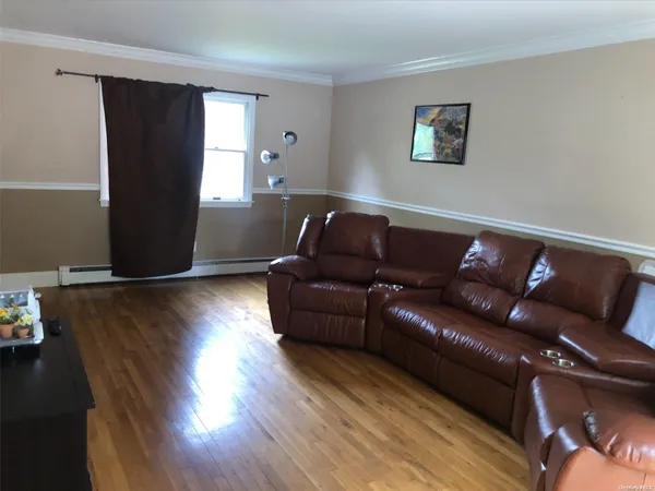 a living room with couch and a window