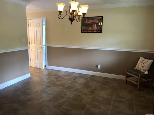 a view of a livingroom with chairs