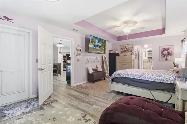 a bedroom with a bed and a mirror