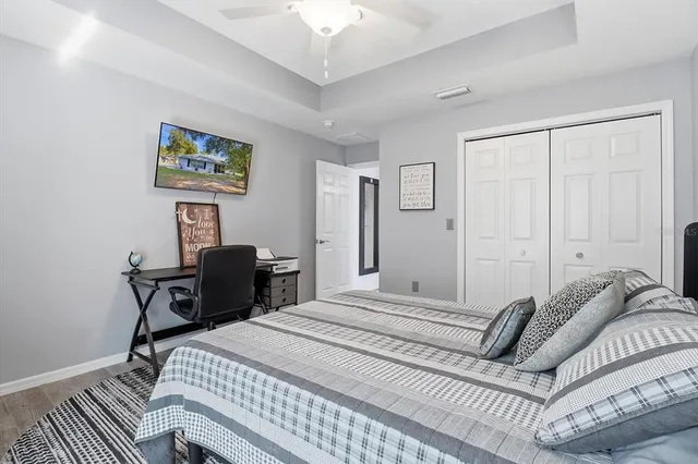 a bedroom with a bed and a desk