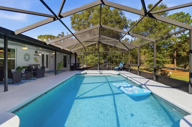 a view of swimming pool with a patio