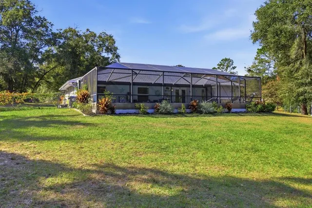 a view of a house with a big yard