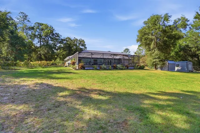 a view of a house with a big yard