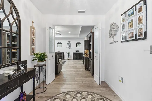 a view of a living room and entryway