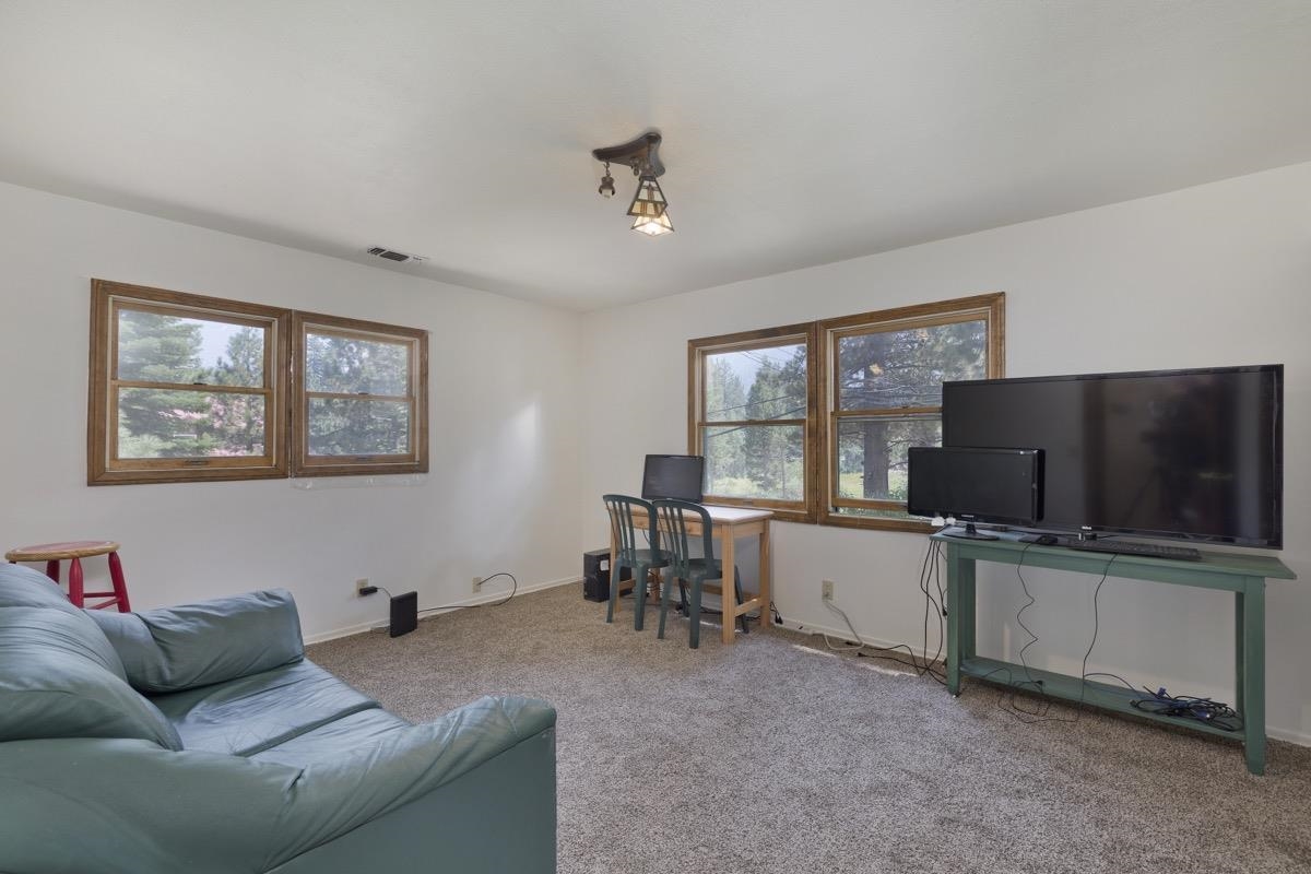 2030 Old Mammoth Road Mammoth Lakes, CA 93546 - Photo 19 of 46 a living room with furniture and a flat screen tv