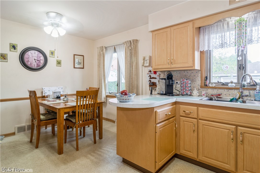 9283 Roxbury Road Parma Heights, OH 44130 - Photo 5 of 24 Large eat in kitchen. Window treatments stay.