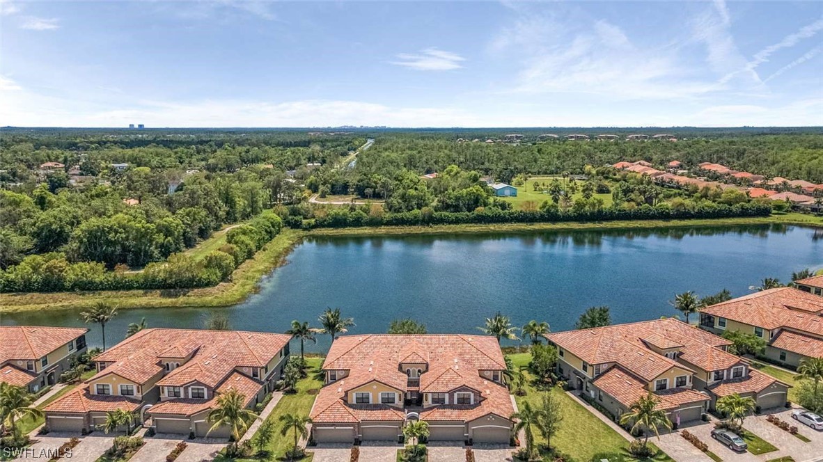 9490 Napoli Lane, Unit 202 Naples, FL 34113 - Photo 1 of 24 an aerial view of a house with a lake view