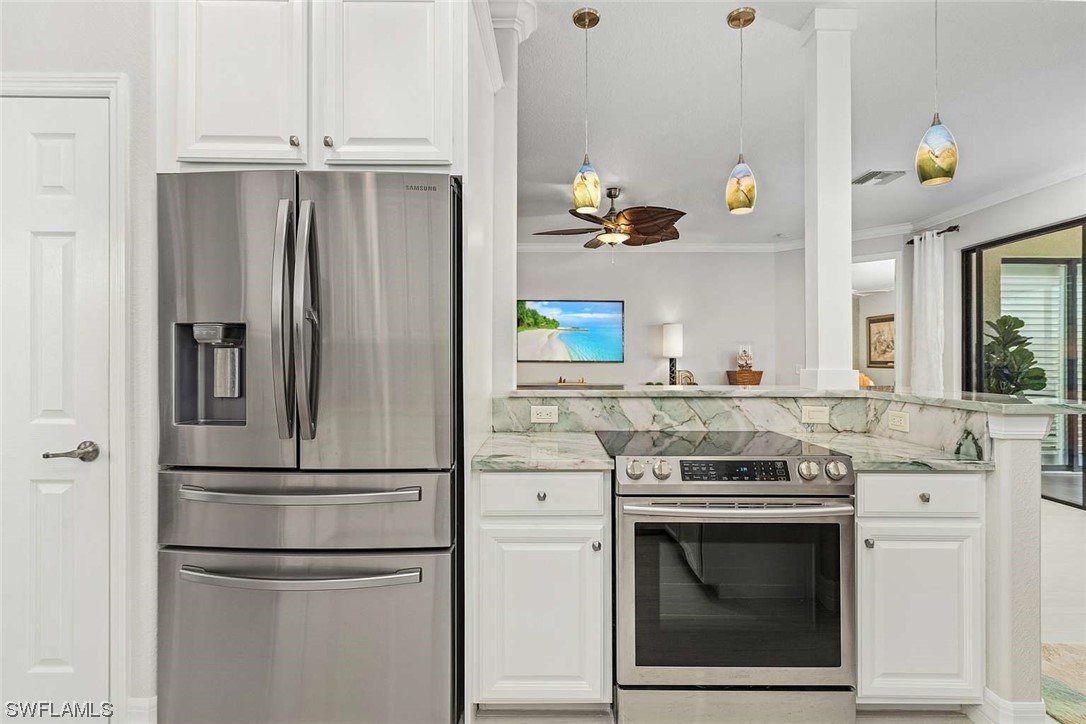 9490 Napoli Lane, Unit 202 Naples, FL 34113 - Photo 11 of 24 a kitchen with appliances and cabinets