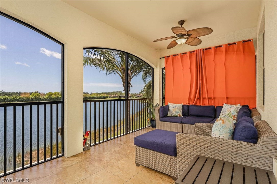 9490 Napoli Lane, Unit 202 Naples, FL 34113 - Photo 20 of 24 a living room with furniture and a large window