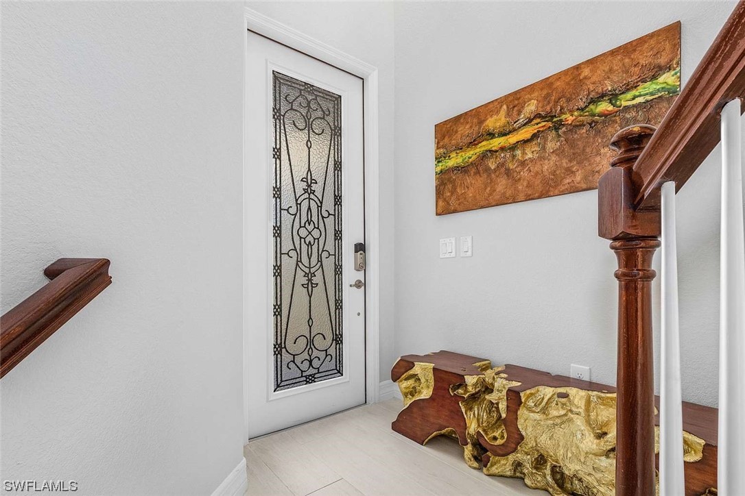 9490 Napoli Lane, Unit 202 Naples, FL 34113 - Photo 2 of 24 a view of walk in closet with clothes and shoes