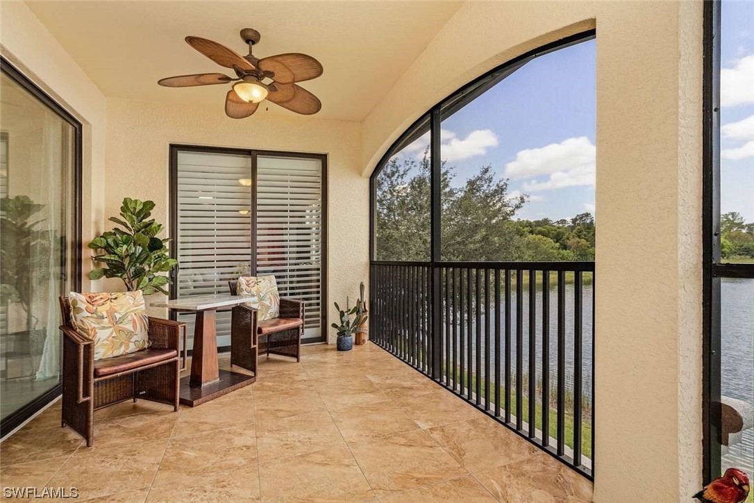 9490 Napoli Lane, Unit 202 Naples, FL 34113 - Photo 21 of 24 a view of a workspace with furniture and a window