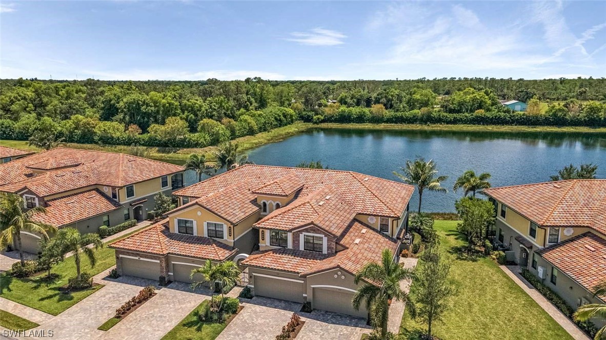 9490 Napoli Lane, Unit 202 Naples, FL 34113 - Photo 22 of 24 an aerial view of residential houses with outdoor space and lake view
