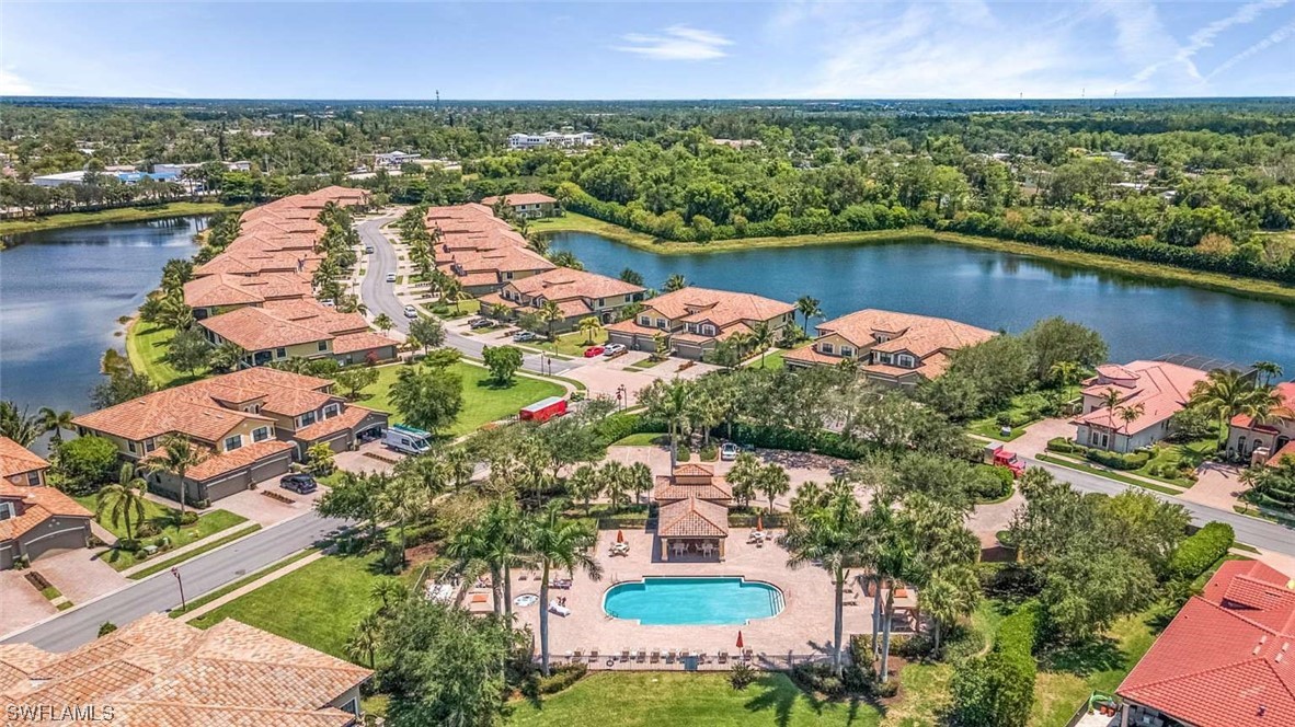 9490 Napoli Lane, Unit 202 Naples, FL 34113 - Photo 23 of 24 a view of a lake with a lake