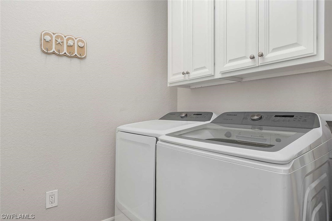9490 Napoli Lane, Unit 202 Naples, FL 34113 - Photo 6 of 24 a utility room with dryer and washer