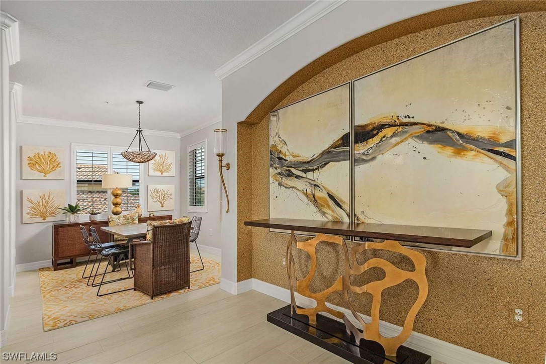 9490 Napoli Lane, Unit 202 Naples, FL 34113 - Photo 7 of 24 a room with furniture and a window