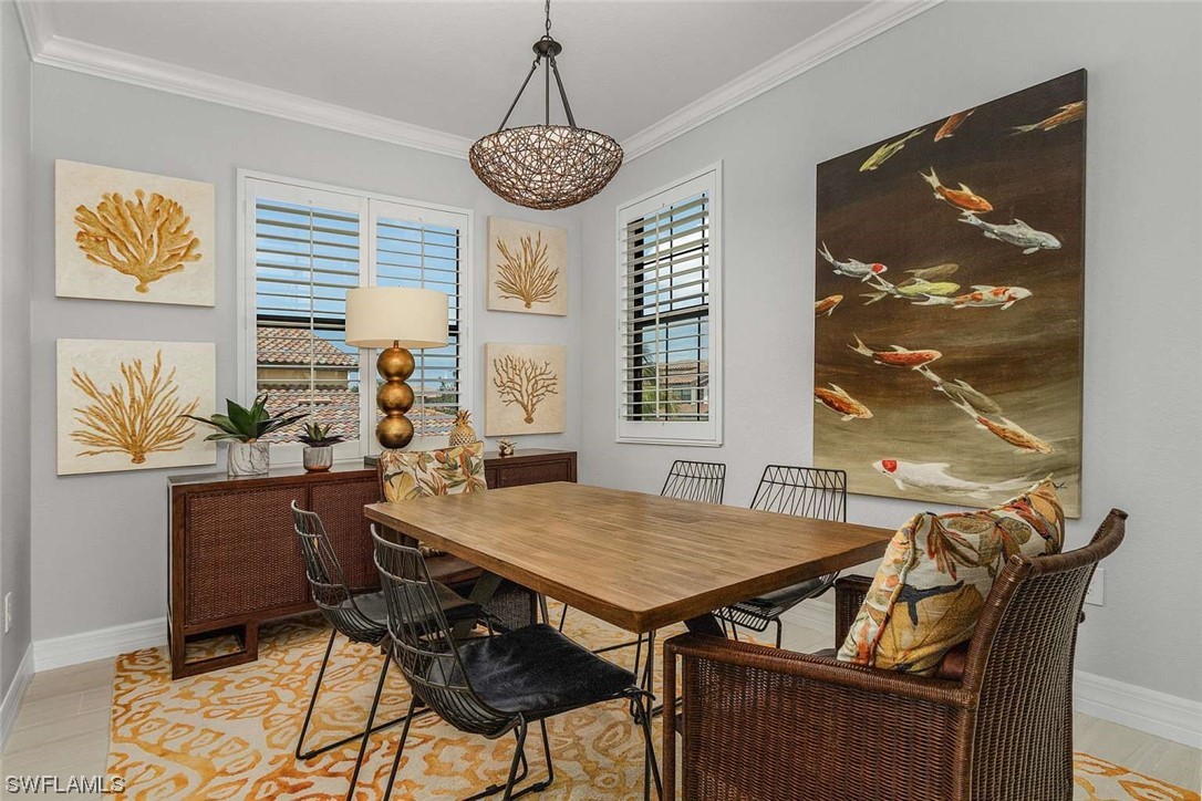9490 Napoli Lane, Unit 202 Naples, FL 34113 - Photo 8 of 24 a view of a dining room with furniture window and outside view