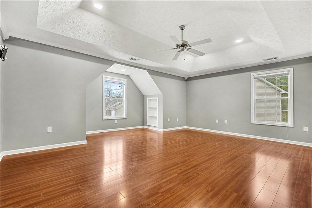 307 Remington Pl Boulevard Dallas, GA 30157 - Photo 14 of 27 a view of an empty room with window and wooden floor