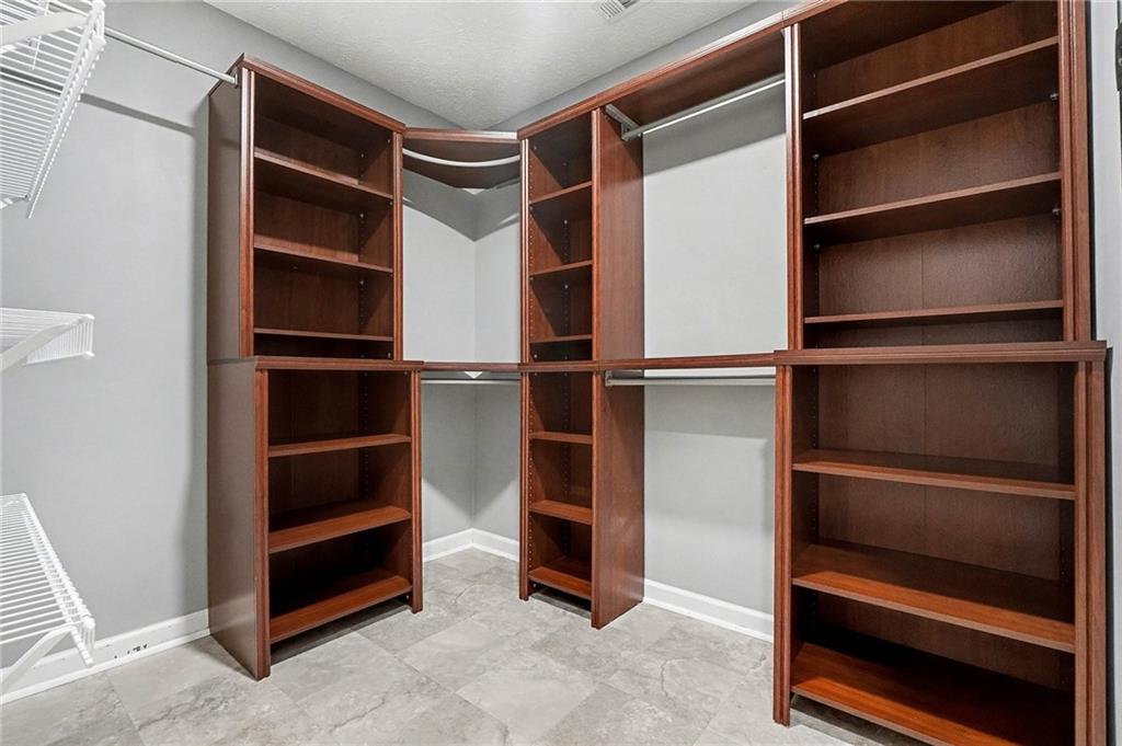 307 Remington Pl Boulevard Dallas, GA 30157 - Photo 19 of 27 a view of walk in closet with empty racks