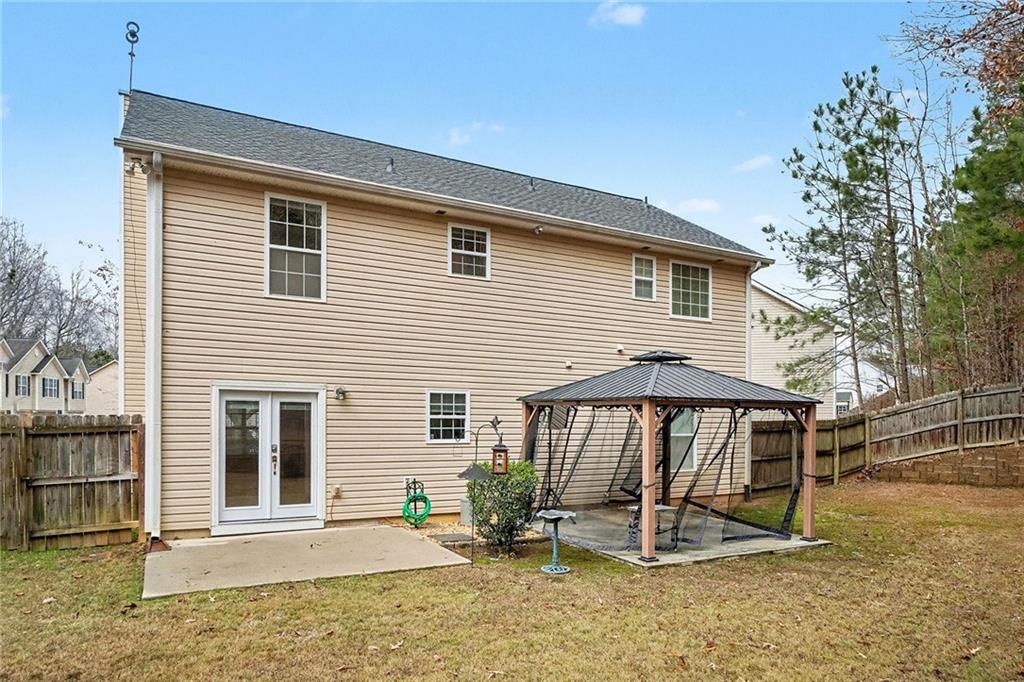 307 Remington Pl Boulevard Dallas, GA 30157 - Photo 24 of 27 a view of a house with backyard and sitting area