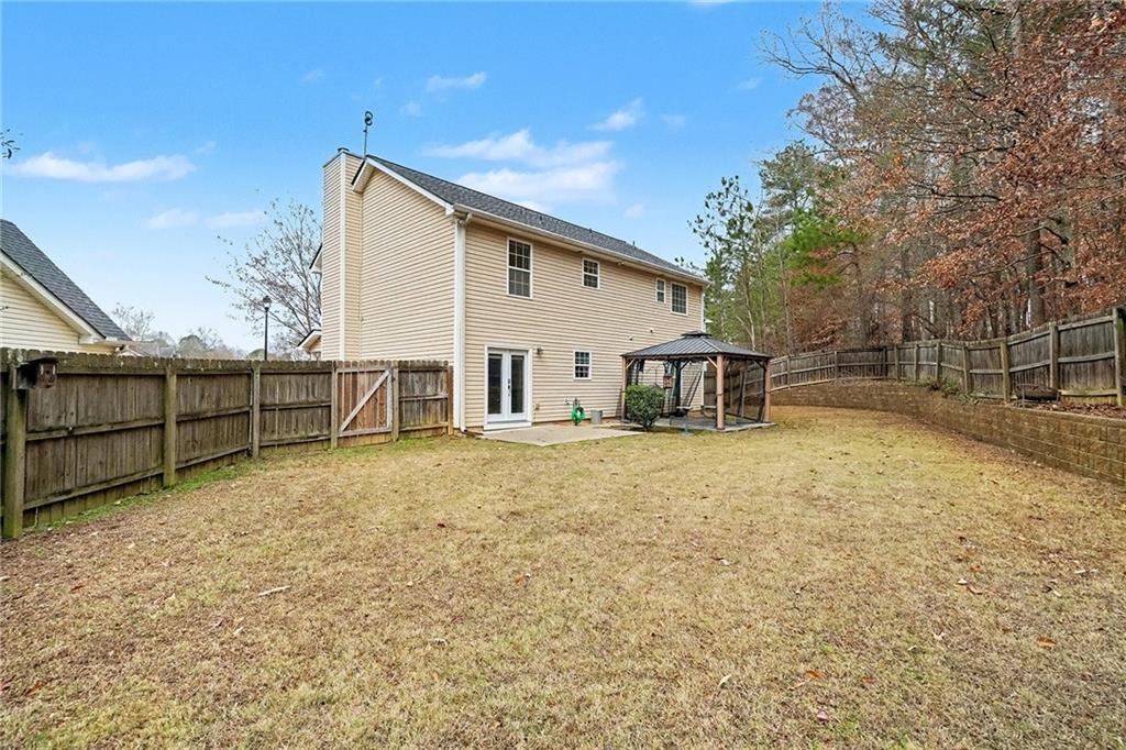 307 Remington Pl Boulevard Dallas, GA 30157 - Photo 25 of 27 a view of a backyard