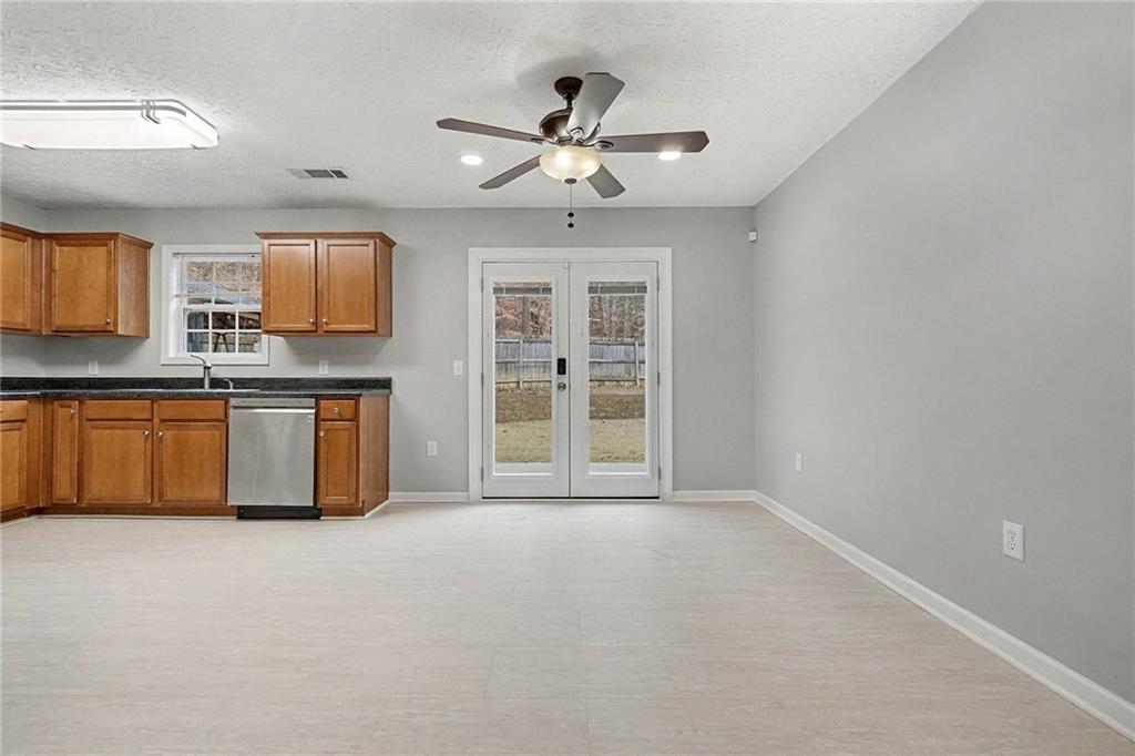 307 Remington Pl Boulevard Dallas, GA 30157 - Photo 6 of 27 a view of a kitchen with a sink cabinets and window