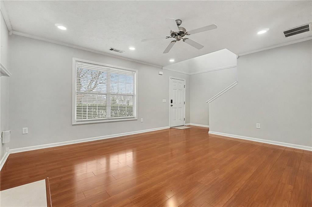 307 Remington Pl Boulevard Dallas, GA 30157 - Photo 7 of 27 a view of an empty room with a window and wooden floor