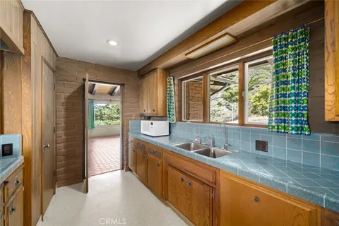 a bathroom with a bathtub and window