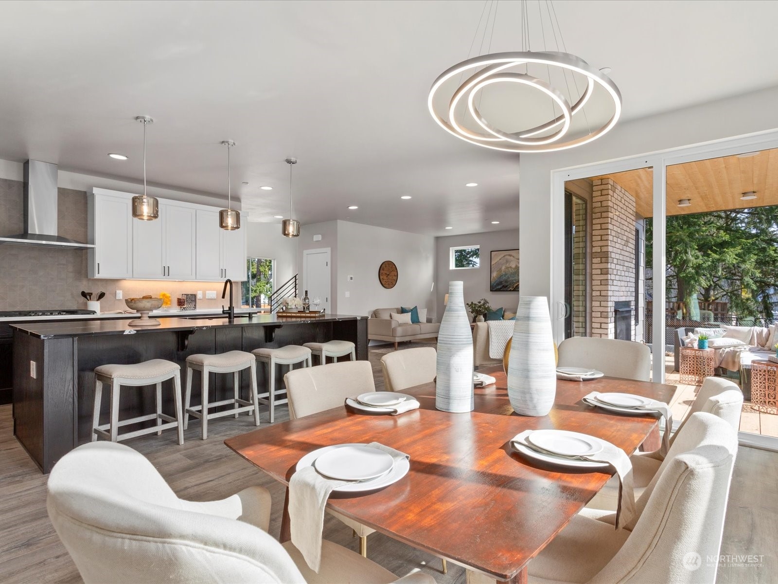 21609 1st Avenue West Bothell, WA 98021 - Photo 11 of 40 a dining room with wooden floor and large windows