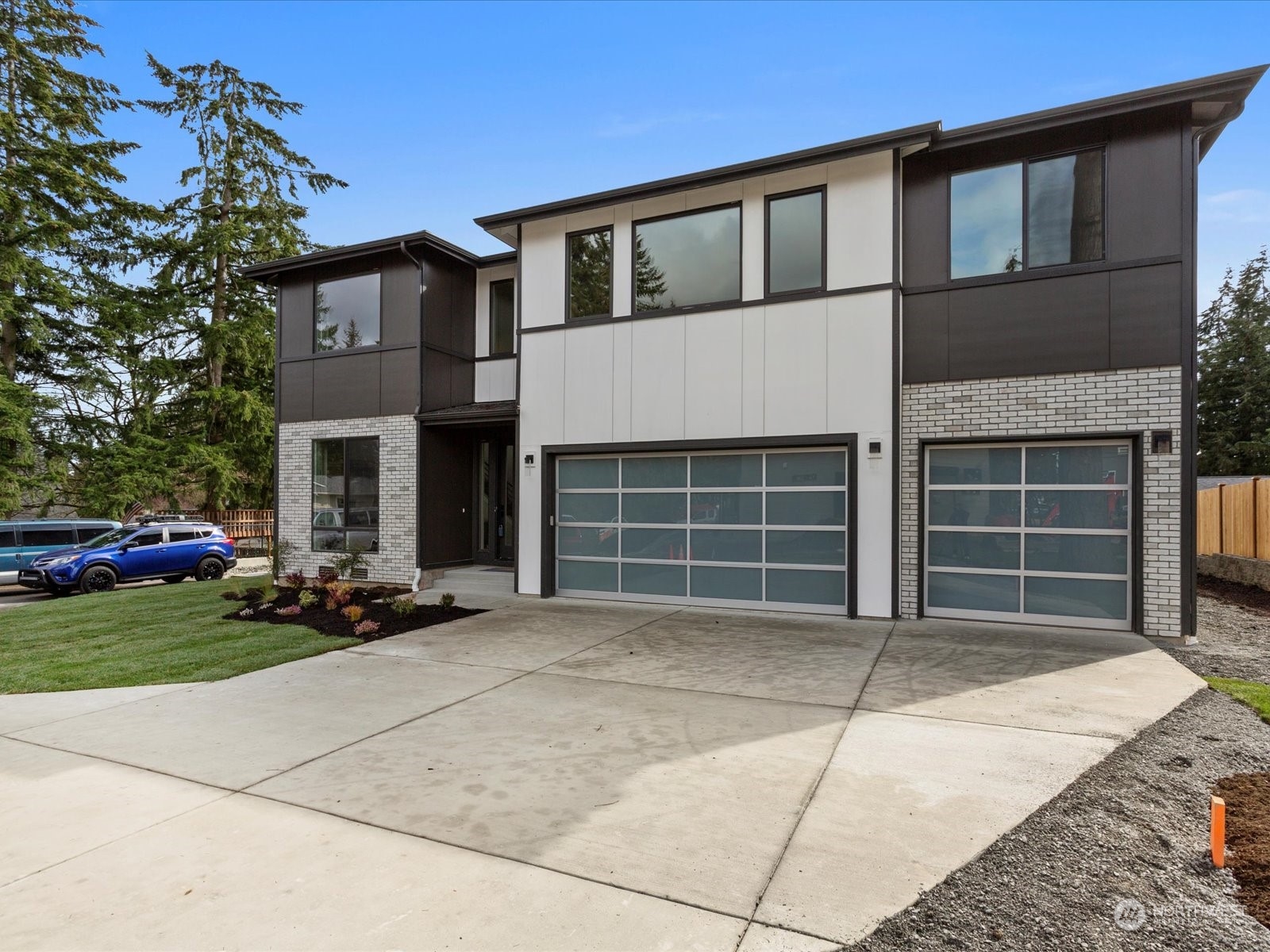 21609 1st Avenue West Bothell, WA 98021 - Photo 2 of 40 a front view of a house with a garden and parking space