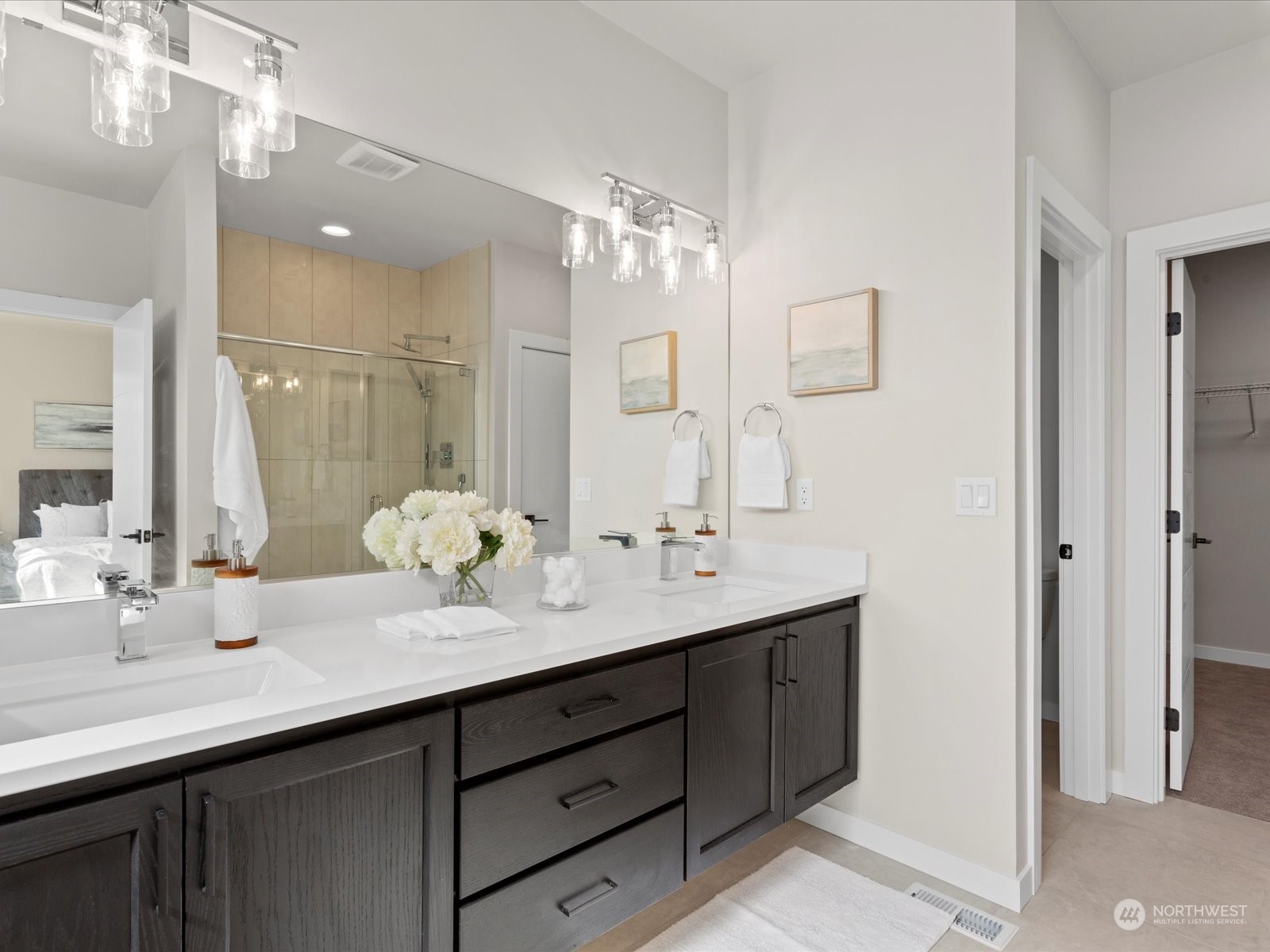 21609 1st Avenue West Bothell, WA 98021 - Photo 28 of 40 a bathroom with a double vanity sink and a mirror