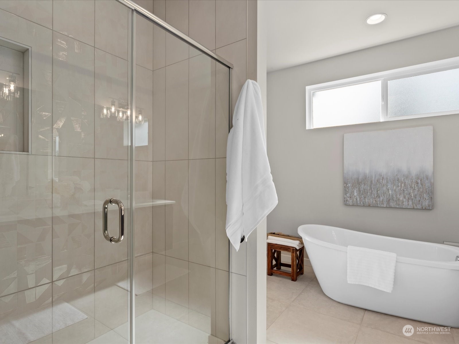 21609 1st Avenue West Bothell, WA 98021 - Photo 29 of 40 a bathroom with a white bath tub a shower and a sink