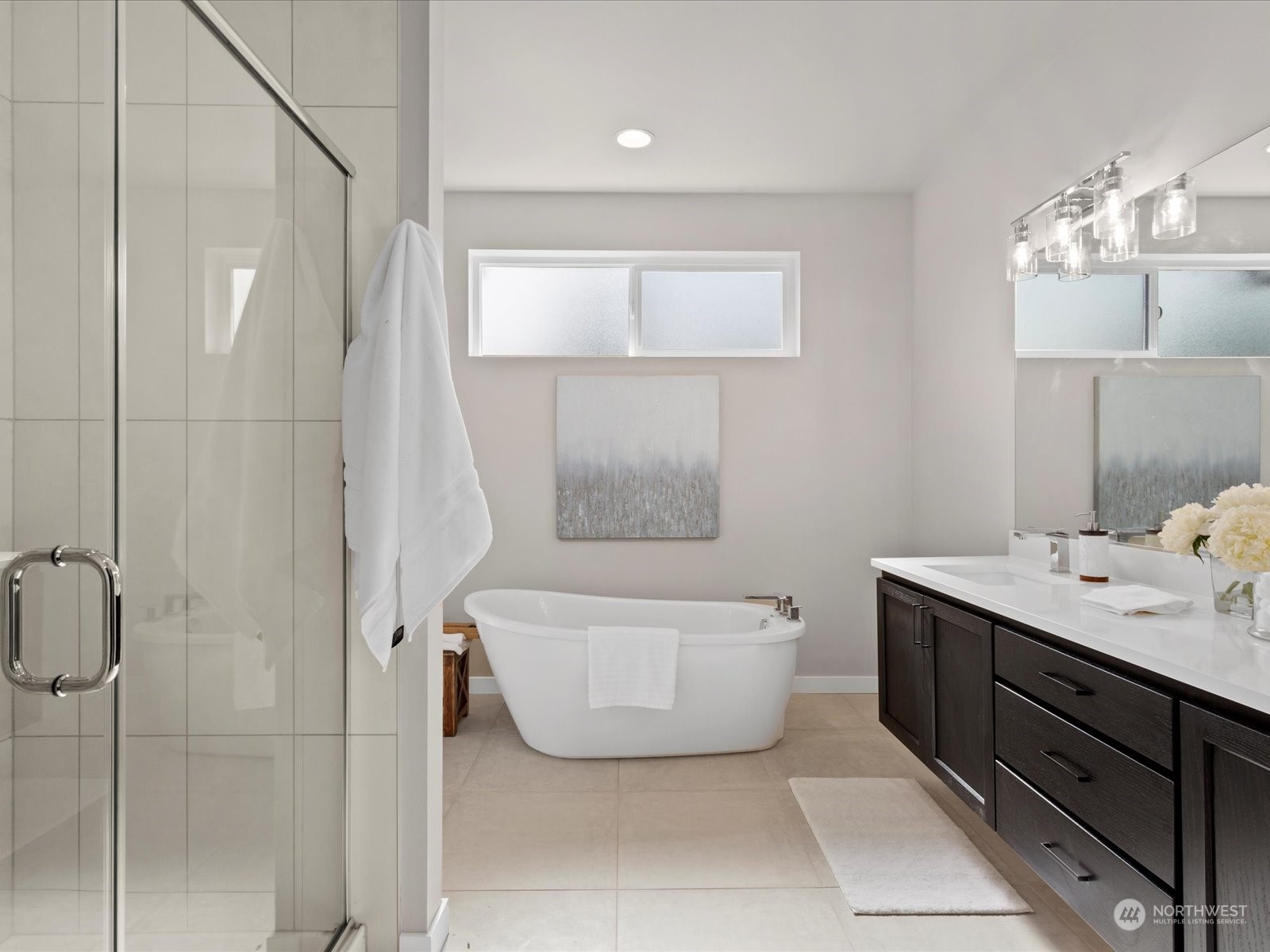 21609 1st Avenue West Bothell, WA 98021 - Photo 31 of 40 a bathroom with a tub sink and mirror